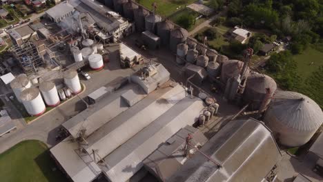 Aerial-birds-eye-shot-of-industrial-factory-with-many-tanks-producing-food-in-Buenos-Aires