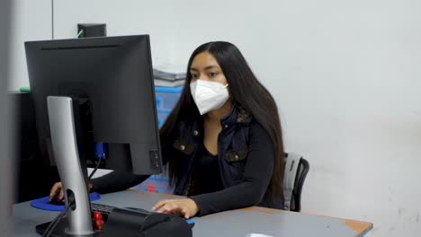 Efficient-Young-Mexican-Secretary-Using-Face-Mask-Keeps-Ophthalmic-Lens-Warehouse-Running-Smoothly