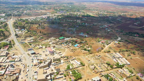 Drone-slowly-revealing-a-busy-town-in-rural-Kenya