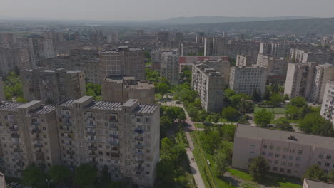Aerial-view-of-old-Soviet-era-housing-buildings-architectural-style-and-residential-blocks-with-cars-parked-inside-it,-Tbilisi,-Georgia