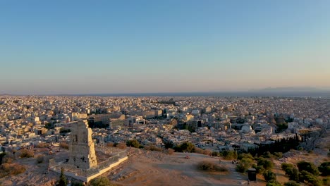City-center-of-Athens,-residential-buildings,-aerial-view-at-sunset-time