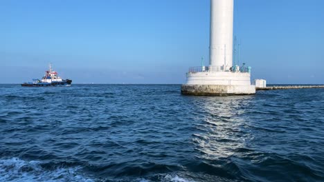 Tugboat-Sailing-At-Black-Sea-Near-Vorontsov-Lighthouse-In-Odesa,-Ukraine