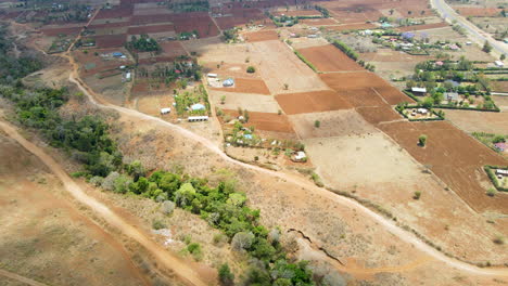 Jib-down-of-farms-and-buildings-in-a-beautiful-rural-landscape-in-Kenya