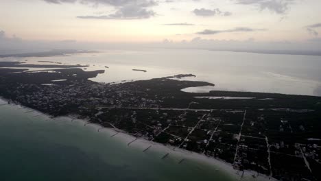 Drone-tilt-shot-of-housing-on-the-beach-Water-island