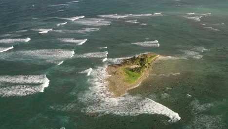 Waves-breaking-on-deserted-islet-near-Las-Galeras,-Samana-in-Dominican-Republic