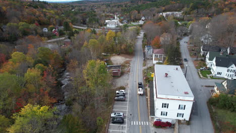 Vehicle-Towing-Boat-on-Road-In-Lake-Sunapee-Neighborhood,-Tracking-Aerial-View