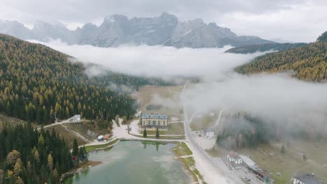 beautiful-tilting-aerial-view-over-Lake-Misurina,-also-known-as-the-Pearl-of-Cadore-in-the-South-Tyrolean-Dolomites
