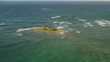 Small-Caribbean-island-in-middle-of-sea-near-Las-Galeras-beach,-Samana-Peninsula
