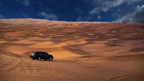 Car-in-desert-Sahara,-sand-dunes,-middle-east-arid-nature,-sky-replacement-effect,-clouds,-landscape,-travel,-tourism,-panoramic-landmark