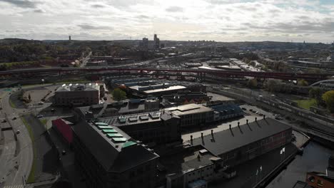 Buildings-and-highways-at-Gothenburg-old-town,-aerial-fly-back-view