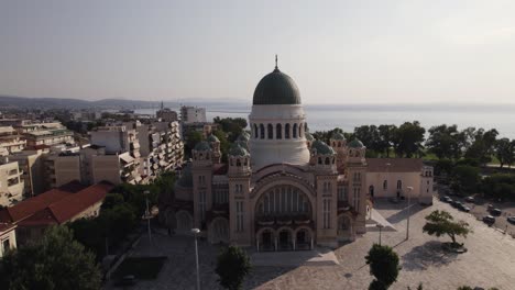 Aerial-pullback-from-Majestic-Cathedral-of-Saint-Andrew-in-Patras-Coastline,-Greece