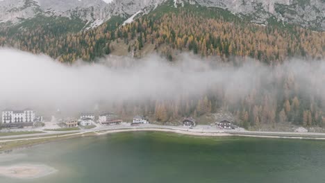drone-flight-shows-the-shore-and-the-asphalt-road-next-to-the-misurina-lake-in-the-dolomites-of-south-tyrol