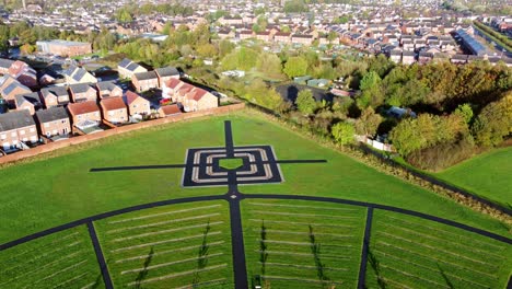 Modern-circular-cemetery-pathway-design-aerial-view-artistic-garden-of-rest-flying-towards-target
