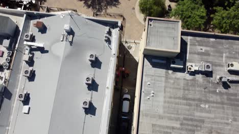 Roof-of-the-Yost-Theather,-tilt-up-revealing-Santa-Ana-cityscape,-Orange-County,-California