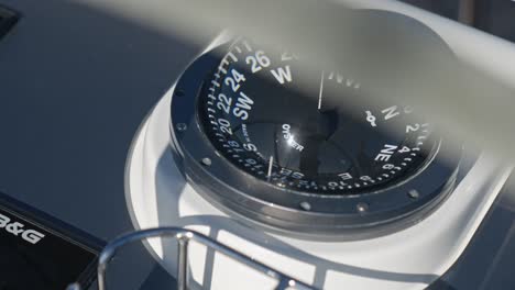 Close-up-shot-showing-compass-on-a-Oyster-Sailing-Yacht-on-ocean