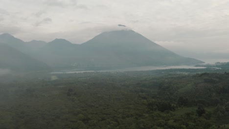 Light-Fog-Covering-The-Green-Forest,-Lake-Atitlan-And-The-Volcanoes-In-Guatemala