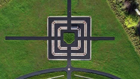 Modern-square-target-cemetery-pathway-design-aerial-view-artistic-garden-of-rest-graveyard-descending-shot