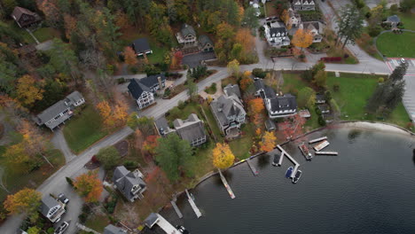 Top-Down-Aerial-View,-Houses-and-Piers-at-Lake-Sunapee-Lakefront,-New-Hampshire-USA