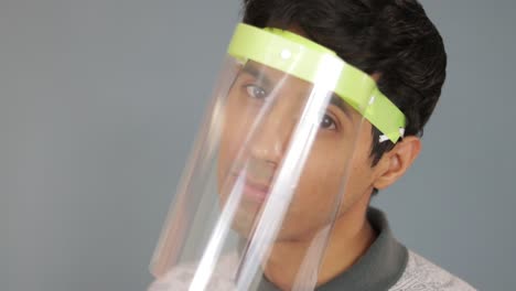 Hispanic-man-wearing-transparent-protective-mask