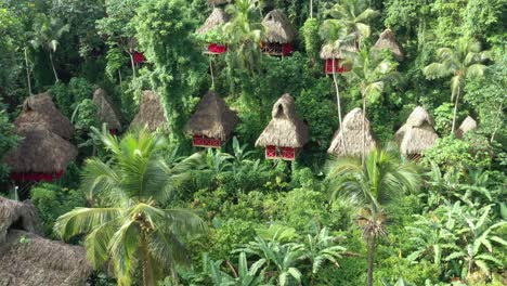 People-sitting-on-window-in-Tree-House-Village-at-Samana-in-Dominican-Republic