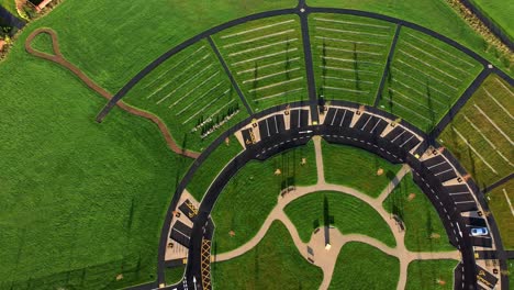 Modern-circular-cemetery-pathway-design-aerial-view-artistic-garden-of-rest-Birdseye-reverse-shot