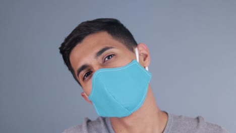 Handsome-hispanic-model-wearing-a-face-mask-at-the-covid-pandemic