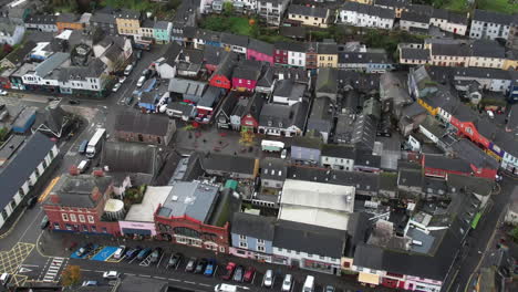 Downtown-Kinsale,-Cork-County,-Ireland,-Aerial-View,-Street-Traffic-and-Colorful-Buildings,-Tilt-Down-Drone-Shot
