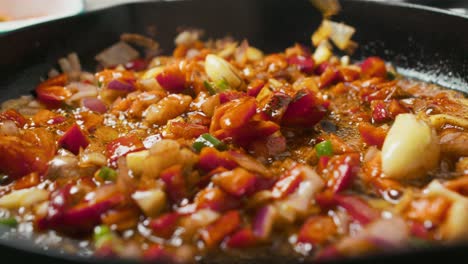 Close-up-on-frying-pan-with-vegetable-mix