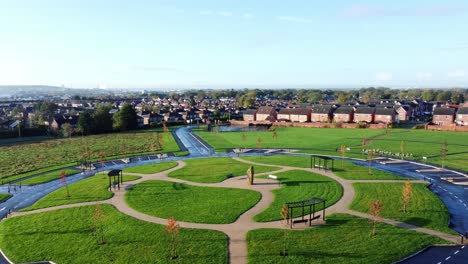 Modern-circular-cemetery-pathway-design-aerial-view-artistic-garden-of-rest-low-horizon-rising-shot-tilt-down