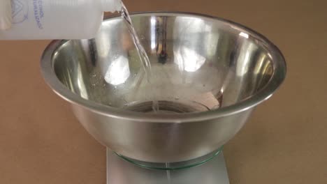 Pour-alcohol-into-a-bowl.-Chemical-instruments