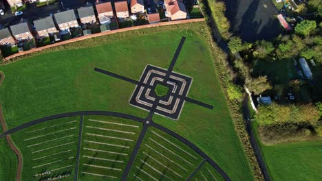 Modern-target-cemetery-pathway-pattern-aerial-view-artistic-garden-of-rest-descending-rotation