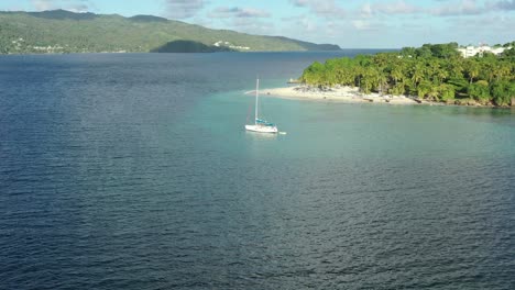 Cayo-Levantado-or-Bacardi-island-and-sailboat,-Samana-in-Dominican-republic