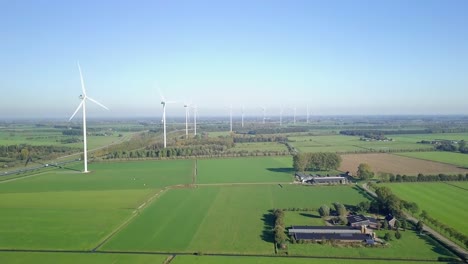Aerial-drone-view-of-farmland-and-wind-turbine-farms-in-the-countryside-in-the-Netherlands,-Europe