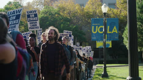 A-Large-Line-of-UC-Academic-Workers-Carry-Signs-on-UCLA's-Campus