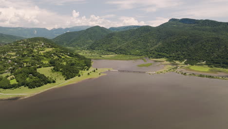 Tkibuli-lake-reservoir-lush-forest-valley-and-bridge-in-Georgia