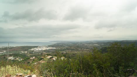 Coastline-of-Estepona-city-on-moody-cloudy-day,-time-lapse-view