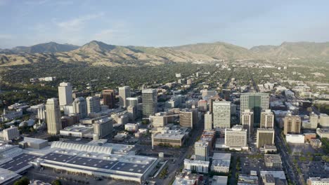 Wide-aerial-view-of-Salt-Lake-City's-downtown-district-with-mountains-in-the-backdrop