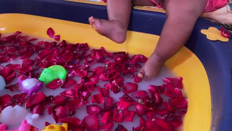 Top-shot-of-baby-shower-going-in-the-bath-tub-decorated-with-rose-petals