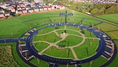 Modern-circular-cemetery-pathway-design-aerial-view-artistic-garden-of-rest-low-to-high-shot