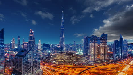 Dubai-by-night,-skyline,-cityscape-night-view,-skyscrapers,-buildings,-Burj-khalifa-hotel,-timelapse-sky-replacement-effect,-cinemagraph