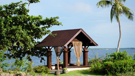 Outdoor-Luxurious-Spa-Treatment-Gazebo-or-Pavilion-for-Two-Persons-by-the-Sea-in-Tropical-Nature-in-Bali