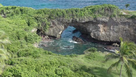 Stone-arch-at-La-Hondonada-coast-in-Samana-Peninsula,-Dominican-Republic