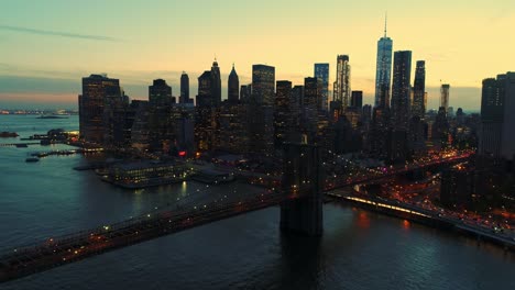 Manhattan-skyscrapers-and-Brooklyn-bridge-illuminated-at-twilight