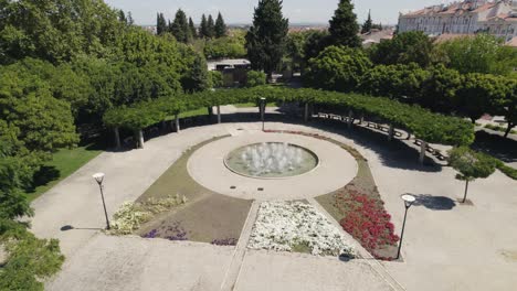 Aerial-Parallax-motion,-Public-garden-with-Flower-patterns-and-Water-fountain---Castelo-Branco