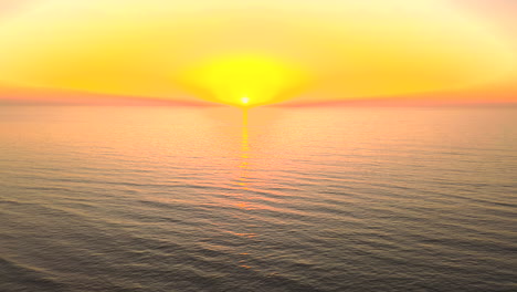 Evening,-golden-hour-sunset-over-the-ocean,-4k-drone-video