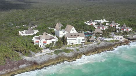 Aerial-tracking-shot-of-luxury-resort-with-epic-Caribbean-Sea-View-at-sunlight---Tulum,Mexico