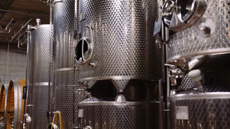 Stainless-steel-wine-fermentation-tanks-in-modern-wine-cellar