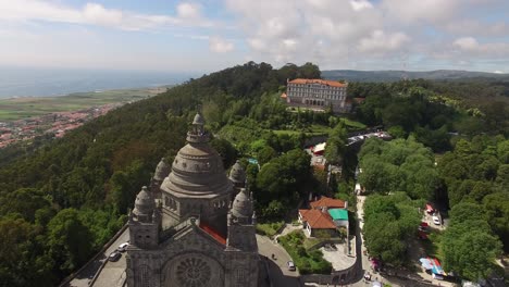 Santa-Luzia-church-sanctuary-drone-aerial-view-in-Viana-do-Castelo-with-city-on-the-background,-in-Portugal