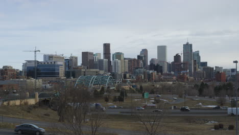 Timelapse-Of-Traffic-Driving-In-The-Road-With-Downtown-Denver-In-Background-In-Denver,-Colorado,-USA