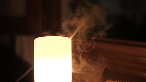Vapor-From-Aroma-Oil-Diffuser-Lamp-On-The-Table